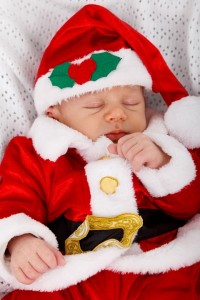 Sleeping baby in Christmas clothes